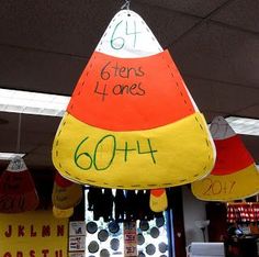 a group of paper hats hanging from the ceiling