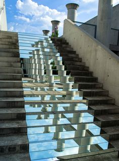 an instagram page with stairs and water reflecting them in the bottom right hand corner