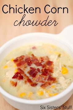 a close up of a bowl of chicken corn chowder soup on a wooden table