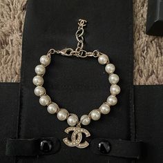 Chanel Pearl Bracelet This Has Been Repaired By Chanel. There Is Tarnishing Shown In Pictures Come With Dust Velvet Holder And Box Chanel Pearl Bracelet, Chanel Pearl, Jewelry Chanel, Chanel Pearls, Chanel Accessories, Chanel Jewelry, Pearl Bracelet, Womens Jewelry Bracelets, Silver Bracelet