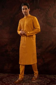 Yellow cotton silk pintuck pattern kurta. Paired with a churidar.
Components: 2
Pattern: Pintuck
Neckline: Stand Collar
Sleeve Type: Full Sleeves
Fabric: Cotton Silk
Color: Yellow
Other Details: 
Concealed button placket
Occasion: Sangeet - Aza Fashions Plain Yellow, Churidar, Full Sleeves, Pin Tucks, Cotton Silk, Button Placket, Aza Fashion, Sleeve Type, Fabric Cotton