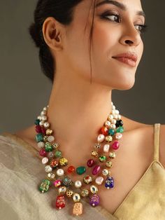 Abdesigns Enhance your elegance with our Multicoloured Kundan Inspired Stones Necklace. This Kundan Necklace embodies the richness of Bollywood Jewelry, making it a must-have for any ethnic jewelry lover. The Navrattan Necklace design features a beautiful array of colorful stones, perfect for any festive occasion. Length: Mala is 28 Inches + Adjustable Thread Material - Brass Plating - Gold Gemstone: White Kundan, Mix Gems & Beads Closure: Pushback/Lobster Hook  Looking for something unique? Che Multicolor Gemstone Beads Jewelry For Celebration, Temple Jewelry Necklaces With Colorful Beads For Celebration, Temple Jewelry Necklace With Colorful Beads For Celebration, Festive Multicolor Gemstone Beads Jewelry, Multicolor Gemstone Beads Necklace For Celebration, Multicolor Gemstone Bead Necklaces For Festive Occasions, Bohemian Gemstone Necklaces For Festive Occasions, Bohemian Multicolor Temple Necklace As Gift, Elegant Multicolor Multi-strand Necklace