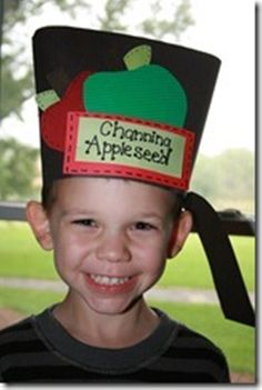 a young boy wearing an apple shaped hat with the words charming appleseed on it