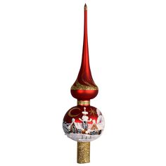 a red and gold christmas ornament on top of a pole