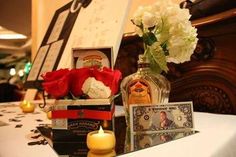 a table with flowers, candles and cards on it