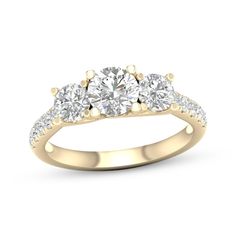 three stone diamond ring in yellow gold