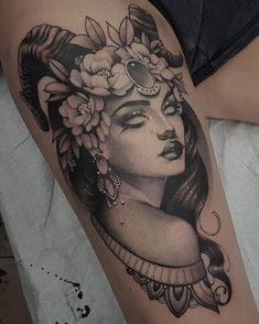 a woman with flowers in her hair on the thigh and shoulder tattoo design by person