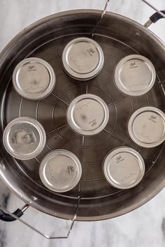 an overhead view of some tins on a stove