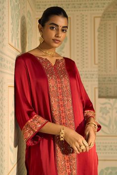 Red kurta with sequin and beads embroidery in geometric pattern. Paired with contrast embroidered hem pant. - Aza Fashions Red Kaftan With Intricate Embroidery For Eid, Red Palazzo Set With Embroidered Border For Eid, Festive Red Kaftan With Intricate Embroidery, Festive Silk Kaftan For Ceremonial Occasions, Elegant Red Kaftan For Diwali, Elegant Red Kurta With Embroidered Border, Bollywood Style Red Palazzo Set With Embroidered Border, Red Embroidered Palazzo Set For Diwali, Red Bollywood Palazzo Set With Embroidered Border