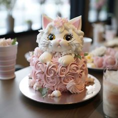 a cat cake sitting on top of a table