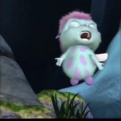 a cartoon character flying through the air in front of a rock and grass covered hill