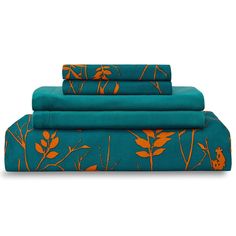 three sheets with orange flowers on them and one is folded up in front of the other