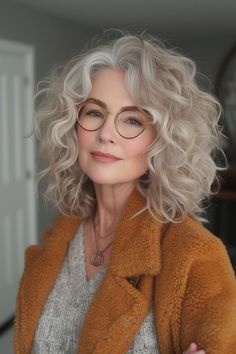 Refresh your look with 16 long hairstyles perfectly suited for women over 60, featuring styles that bring out the best in mature locks. Hairstyles For Fifty Year Old Women, Curls And Glasses, Short Curly Grey Hair, Shoulder Length Permed Hair, Grey Hair And Glasses, Classic Pixie, Κούρεμα Bob, Beautiful Gray Hair