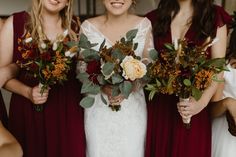 the bride and her bridesmaids are holding their bouquets in each other's hands