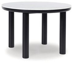 a round table with black legs and a white marble top