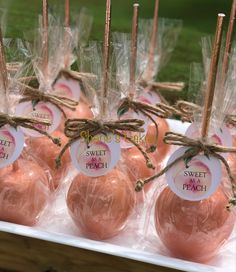 some pink eggs wrapped in plastic and tied with twine on top of each other