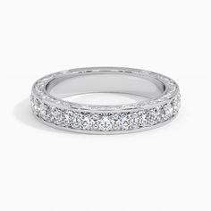 Luxe Antique Scroll Diamond Wedding Ring (3/4 ct. tw.) - Platinum. This eye-catching antique-style ring is engraved with delicate scrolls that wind around the sides of the band. Round brilliant diamonds are bead-set across the top half of the band, adding a luxurious sparkle. Antique Style Rings, Bead Set, Diamond Wedding Ring, Diamond Wedding Rings, Antique Style, Diamond Wedding, Eternity Ring, Quality Jewelry, Round Brilliant