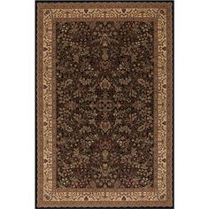 a large rug with an intricate design on the front and side, in black and beige colors