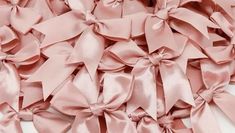 pink satin bows are arranged on top of each other