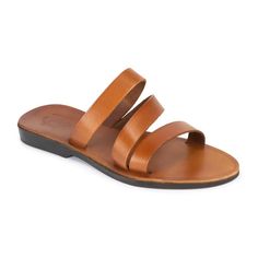 Classic Slide Sandals For The Beach, Leather Toe Loop Slides For Beach, Classic Slide Sandals With Leather Lining, Classic Leather Footbed Sandals For Beach, Classic Leather Slides For Vacation, Classic Single Toe Strap Footbed Sandals For Beach, Classic Toe Loop Sandals For The Beach, Classic Sandals With Heel And Toe Loop, Classic Single Toe Strap Slides For Beach