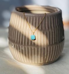 This is a tiny and dainty turquoise pendant necklace with an 18k gold finish over sterling silver. Turquoise represents wisdom, tranquility, protection, good fortune, and hope. Each order comes in a gift box and jewelry pouch, making it the perfect gift. *Please note, natural gemstones have slight variations so each piece will be unique and may vary slightly from what is pictured. This is handmade with love in my Gilbert, Arizona studio. Necklace Details: Finish: 18K Gold Material: Solid 925 Ste Gold Turquoise Pendant Necklace In Sterling Silver, Minimalist Charm Necklace With Natural Stones For Gifts, Dainty Gold Turquoise Necklace As Gift, Elegant Turquoise Charm Necklace For Gift, Dainty Yellow Gold Turquoise Necklace For Gift, Spiritual Turquoise Jewelry For Everyday, Everyday Spiritual Turquoise Jewelry, Blue Turquoise Necklace With Delicate Chain, Gold Amazonite Gemstone Necklaces