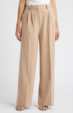 Move from desk days to drinks dates in gracefully draped pants cut from a feel-good fabric. 30" inseam; 24" leg opening; 13" front rise; 16 1/2" back rise (size 8) Zip fly with hook-and-bar closure 62% REPREVE® recycled polyester, 33% rayon, 5% spandex REPREVE recycled polyester is made from 100% post-consumer recycled plastic bottles Machine wash, tumble dry Imported Formal Bottoms With Elastic Waistband And Tapered Leg, Beige Dress Pants With Elastic Waistband For Work, Spring Classic Full Length Wide Leg Pants, Formal Pants With Elastic Waistband For Fall, Formal Elastic Waistband Pants For Fall, Relaxed Fit Full Length Office Bottoms, Spring Full Length Dress Pants For Workwear, Elegant Relaxed Fit Full-length Bottoms, Spring Office Pants Full Length