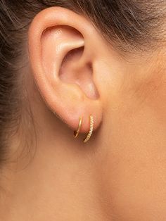 Get double the impact with minimal hardware. Our Seeing Double Earrings spiral around for a unique look that you only need one ear piercing for. These Sterling Silver or gold spiral earrings give you both a studded look and a delicate look — what more could you ask for? | Gold Seeing Double Spiral Hoop Earrings | Women's Jewelry by Uncommon James One Ear Piercing, Minimalist Ear Piercings, Uncommon James, Seeing Double, Double Earrings, Spiral Earrings, Ear Piercing, Earrings In Gold, Jewelry Cleaner