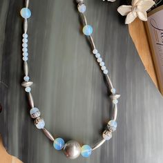 Opalite and stainless steel necklace, a handmade long beaded necklace Rain Design, Latest Jewellery Trends, Long Beaded Necklace, Latest Jewellery, Hook Clasp, Steel Necklace, Stainless Steel Necklace, Fish Hook, Jewelry Trends