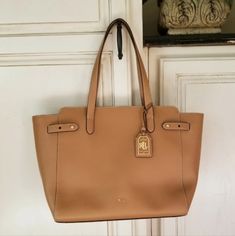 The Harper Parker Tan Leather Tote From Lauren By Ralph Lauren Is A Must Have Addition To Your Handbag Collection. Crafted From Premium Smooth (Composition) Cow Leather Featuring Gold Tone Hardware. Signature Rll Branding Adds Detail Throughout As Well As Classic Luggage Tag. Secure Top Zip Closer Reveals A Spacious Main Compartment Featuring Plenty Of Room For All Your Daily Essentials. I Had Tag But Took It Off. Never Used The Bag. $245.90 Details Tan Leather Smooth Design Gold Tone Hardware Z Polo Ralph Lauren Faffia Bag, Classic Luggage, Ralph Lauren Tote, Tan Leather Tote, Beige Tote Bag, Beige Tote, Ralph Lauren Bags, Ralph Lauren Leather, Handbag Collection