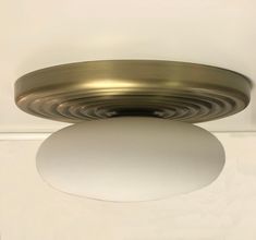 a round light fixture mounted on the ceiling