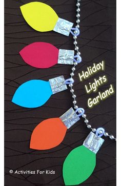 an image of holiday lights garland made out of paper and chain link bracelets on a black background