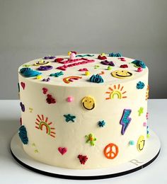 a white cake with colorful decorations on it