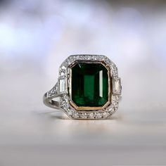 Luxury Heirloom Green Halo Ring, Exquisite Green Emerald Platinum Ring, Exquisite Emerald Cut Emerald Ring, Exquisite Gia Certified Emerald Cut Emerald Ring, Octagon Platinum Emerald Ring, Luxury Green Emerald Ring With Bezel Setting, Elegant Octagon Gia Certified Emerald Ring, Gia Certified Green Emerald Art Deco Ring, Elegant Gia Certified Octagon Emerald Ring