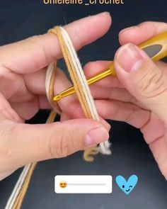 two hands holding scissors and stringing together