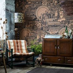 a living room filled with furniture and walls covered in wallpaper