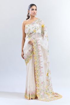 Ivory organza saree with multi color floral embroidery. Comes with matching embroidered unstitched blouse piece. - Aza Fashions White Organza Pre-draped Saree For Eid, White Floral Embroidered Pre-draped Saree For Wedding, Festive White Organza Pre-draped Saree, White Silk Saree For Reception, White Floral Embroidered Chanderi Pre-draped Saree, Fitted White Organza Pre-draped Saree, White Pre-draped Saree With Dupatta In Organza, White Georgette Pre-draped Saree With Floral Embroidery, White Pre-draped Organza Saree With Dupatta