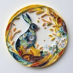 a paper plate with an image of a rabbit on it's side, surrounded by flowers and leaves