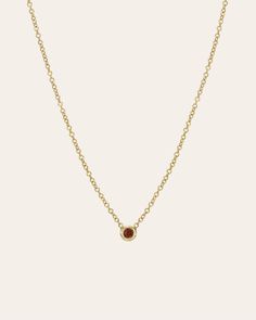 Beautifully handcrafted 14k solid gold mini bezel cup with the birthstone of your choice hanging from a dainty cable link chain. Makes the perfect gift with a personal touch. Made in L.A. Total Weight: Approx. 1 gram Birthstone Bezel Carat Weight: Approx. 0.03 ctw Available Birthstones: Garnet, Amethyst, Aquamarine, Diamond, Emerald, Alexandrite, Ruby, Peridot, Sapphire, Rose Zircon, Topaz, Blue Zircon Ships in 5-8 business days Rush orders ship in 3-5 business days Due to the nature of this item all stones may vary in color and inclusions making each piece a one of a kind. All personalized items are final sale Comes gift ready in a custom Zoe Lev jewelry box. Gold Minimalist Birthstone Necklace With Bezel Setting, Everyday Gold Birthstone Necklace With Bezel Setting, 14k Gold Birthstone Necklace With Bezel Setting As Gift, 14k Gold Bezel Setting Birthstone Necklace Gift, Dainty Gold Birthstone Necklace With Bezel Setting, Classic 14k Gold Birthstone Necklace With Bezel Setting, Dainty Yellow Gold Necklace With Smooth Bezel, Gold Solitaire Necklace With Smooth Bezel As A Gift, Minimalist 14k Gold Birthstone Necklace With Bezel Setting