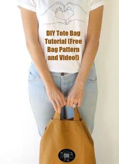 a woman holding a brown bag with the words diy tote bag on it