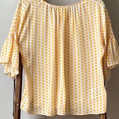 Brooks Brothers Polka Dot Blouse In Creamy White And Buttery Yellow. Flowy And Semi-Sheer Fabric (Includes Lightweight Camisole Liner). Tie Back. Pretty And Classy! 19” Bust, 20” Length Polka Dot Blouse For Summer Day Out, Polka Dot Blouse For Day Out In Summer, Polka Dot Blouse For A Summer Day Out, Polka Dot Blouse For Summer Brunch, Yellow Short Sleeve Blouse For Brunch, Red Peplum Tops, Brooks Brothers Women, Blue And White Shorts, White Floral Blouse