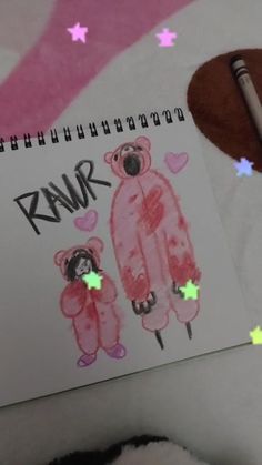 a notebook with an image of two bears and the words rawr written on it