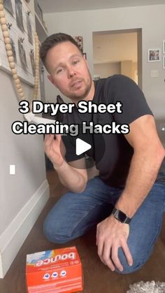 a man sitting on the floor in front of a box of cleaning hacks with text overlay that reads, 3 dryer sheet cleaning hacks