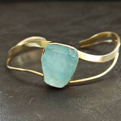 Hand made, sterling silver, light blue agate, cuff bracelet, with a 18k yellow gold finish. Adjustable Gold Chalcedony Jewelry, Modern Light Blue Jewelry For Formal Occasions, Modern Chalcedony Jewelry With Polished Finish, Aquamarine Bracelet Jewelry As A Gift, Formal Jewelry With Natural Chalcedony Stones, Aquamarine Bracelet Jewelry Gift, Light Blue Bangle Jewelry Gift, Light Blue Bangle Jewelry For Gift, Formal Chalcedony Jewelry With Natural Stones