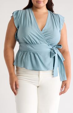 Go from the work day to weekend in this lightweight silk-kissed wrap top fashioned with cap sleeves, a tie waist and fluttery peplum. True wrap style with side tie closure Surplice V-neck Cap sleeves 85% viscose, 15% silk Dry clean Imported Chic V-neck Belted Top, Solid Color Summer Top With Tie Waist, Summer Solid Color Tops With Tie Waist, Solid Summer Top With Tie Waist, Summer Solid Top With Tie Waist, Spring V-neck Wrap Top In Solid Color, Fitted Wrap Top With Tie Waist For Spring, Casual Summer Faux Wrap Top, Casual Faux Wrap Top For Summer