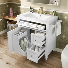 a white sink sitting under a bathroom mirror next to a wooden counter top with drawers