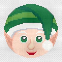 Christmas elf face cross stitch on white aida cloth Elf Cross Stitch Pattern, Elf Cross Stitch, Santa Claus And Mrs Claus, Ornament Cross Stitch, Stitch Ears, Elf Face, Easy Cross Stitch, Christmas Bunting, Xmas Cross Stitch