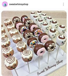 chocolate covered donuts with sprinkles and marshmallows on sticks