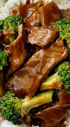 beef and broccoli with sauce on top of rice