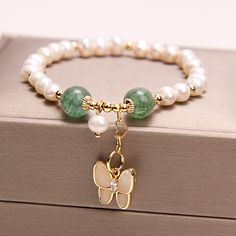 Pearl Crystal Bracelet With Pearl Charm As Gift, White Butterfly Bracelet For Gift, Butterfly Charm Jewelry With Round Beads As Gift, Elegant Jewelry With Butterfly Charm And Round Beads, White Butterfly Charm Bracelet For Gift, Pearl Jewelry With Butterfly Charm For Gift, Pearl Jewelry With Butterfly Charm As Gift, Pearl Jewelry With Butterfly Charm, Pearl Butterfly Charm Jewelry