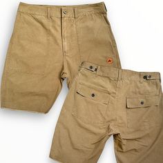 Made In LA Our Workman Ripstop short is a durable, reinforced weave fabric perfect for those that desire a more tear resistant bottom. A comfortable, wearable piece that will add a touch of character to your closet. Complete with zip fly , deep front pockets and two back pockets with button flaps to keep everything secure. Side tabs ensure a perfect fit. Details: *100% Cotton Ripstop Crosshatch Weave*Stonewashed finishing (pre-shrunk)*9" inseam (knee length)*Side tabs for waist adjustment*Dual B Cotton Cargo Shorts For Outdoor Activities, Outdoor Cotton Shorts With Belt Loops, Cotton Shorts With Belt Loops For Outdoor Activities, Beige Cotton Bottoms For Outdoor Activities, Outdoor Khaki Shorts With Patch Pockets, Brown Cotton Shorts For Outdoor Activities, Outdoor Fitted Shorts With Pockets, Fitted Outdoor Shorts With Pockets, Cotton Shorts With Hip Pockets For Outdoor